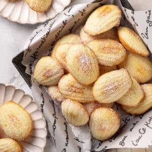 Madeleines top view serving on scalloped plates.