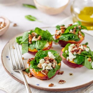 nectarine-salad-on-a-white-plate-with-a-fork-on-a-towel
