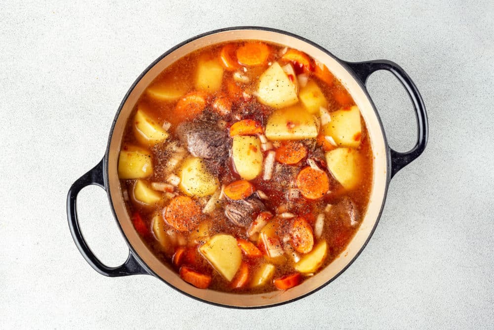 beef-stew-cooking-in-a-pot-with-spices-on-top