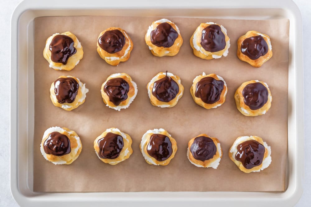 eclairs-covered-in-chocolate-on-a-baking-sheet