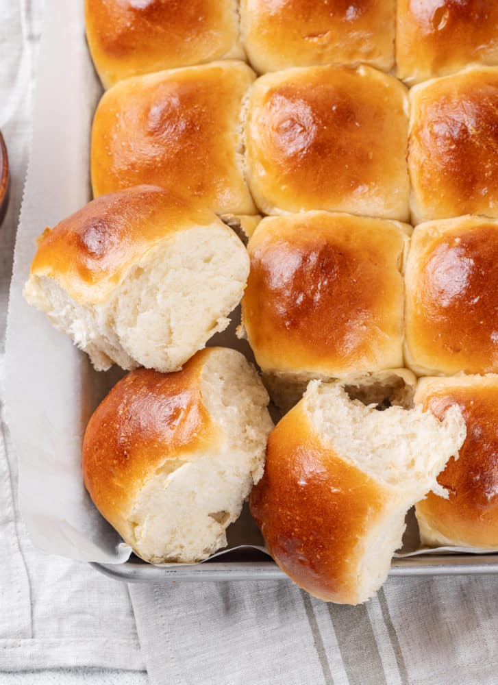 dinner-rolls-on-a-baking-shee-with-parchment-paper