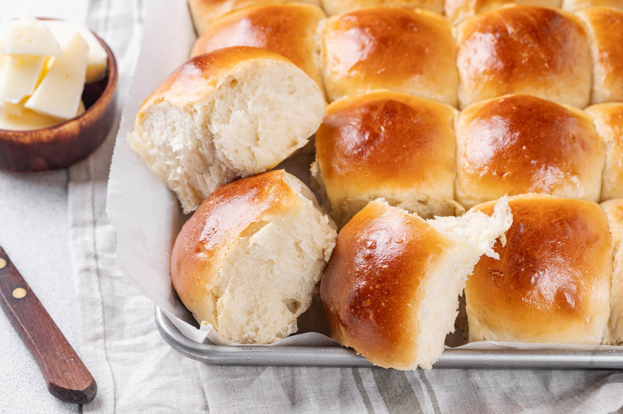 dinner-rolls-in-a-baking-sheet-on-a-towel