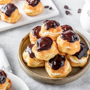 eclairs-covered-in-chocolate-in-a-brown-plate