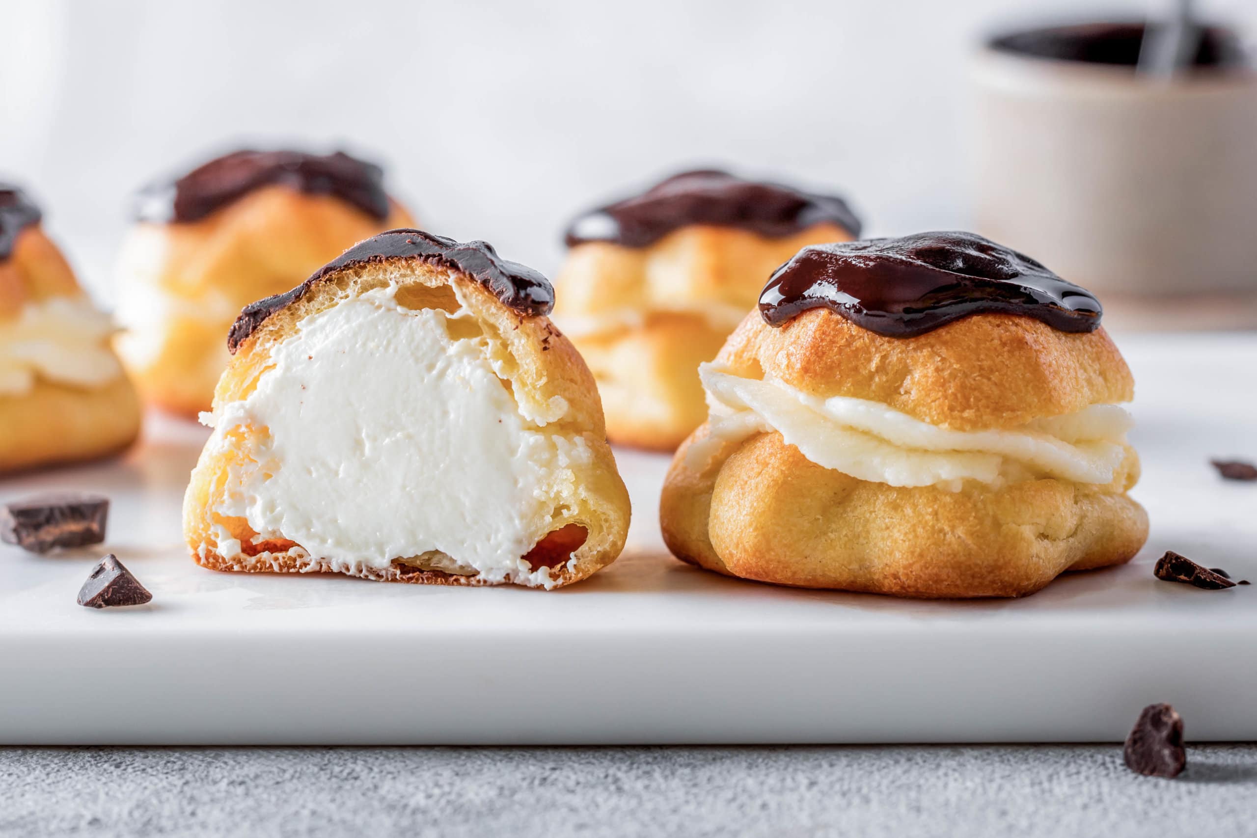 Classic Eclair Recipe with Cream and Chocolate Glaze - All We Eat