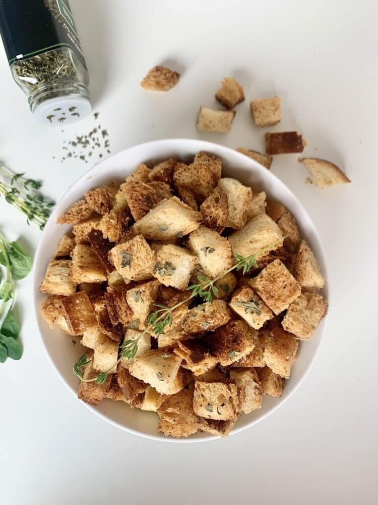 croutons-in-a-white-bowl-with-oregano-and-more-croutons-on-the-side
