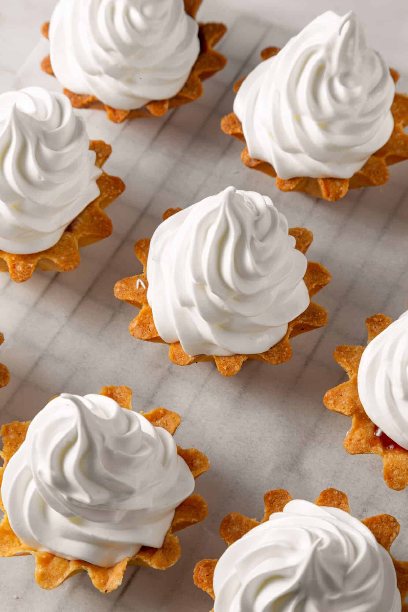 Meringue Jam Filled Tartlets Meringue tartlets close up.