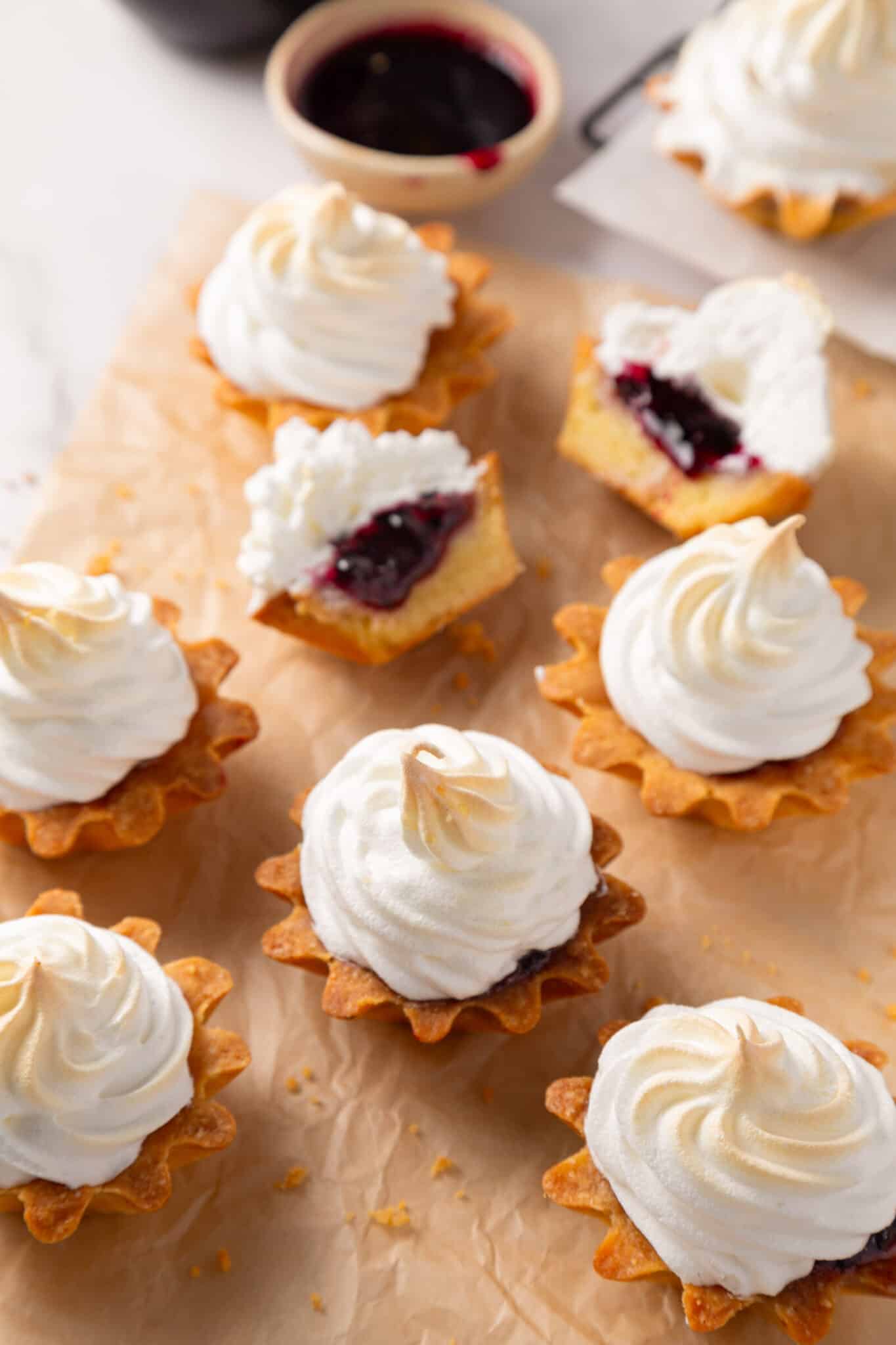 Meringue tartlets with jam filling.