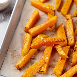 butternut-squash-fries-on-parchment-paper-on-a-baking-tray