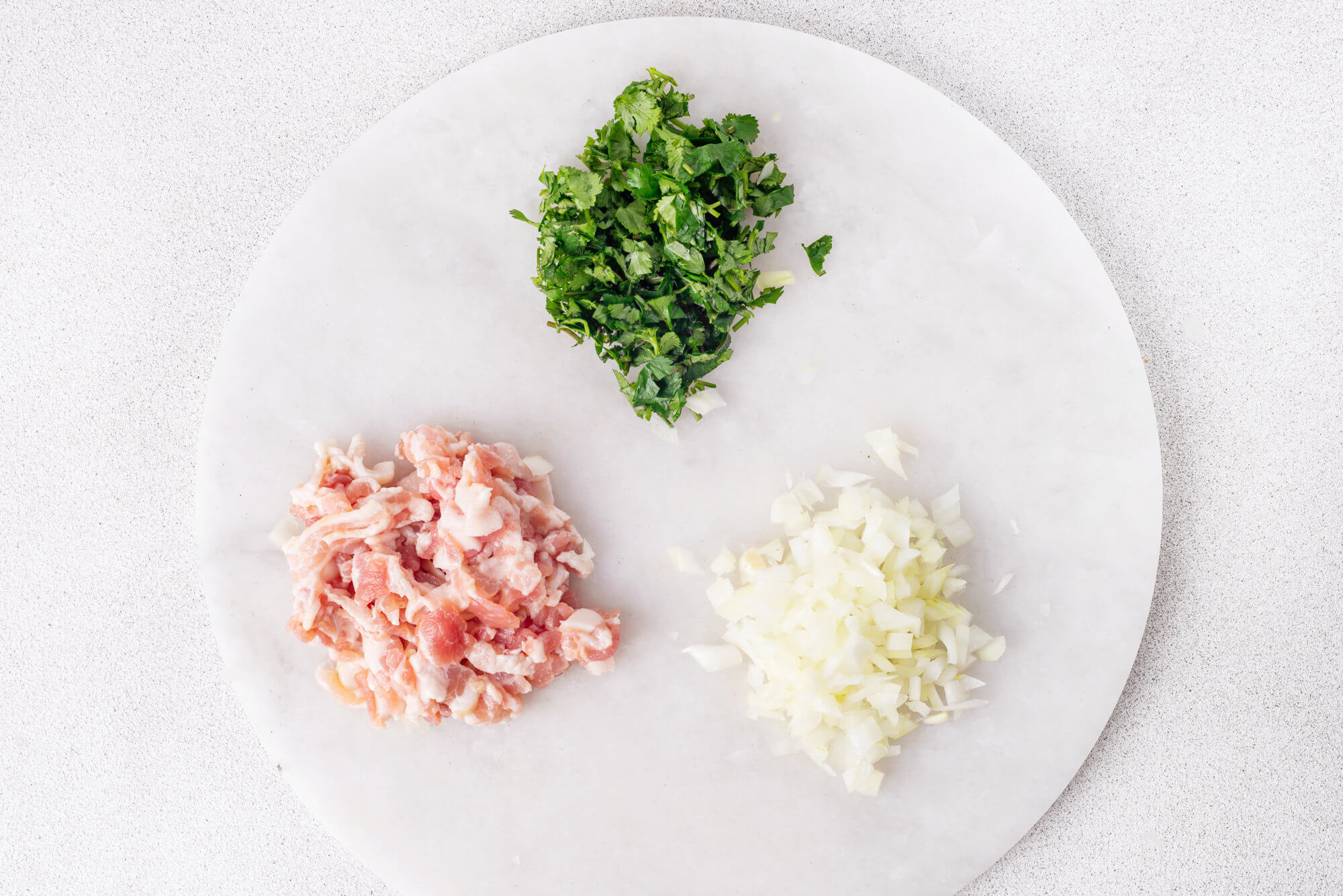 lula-lamb-kebab-ingredients-chopped-on-a-white-plate