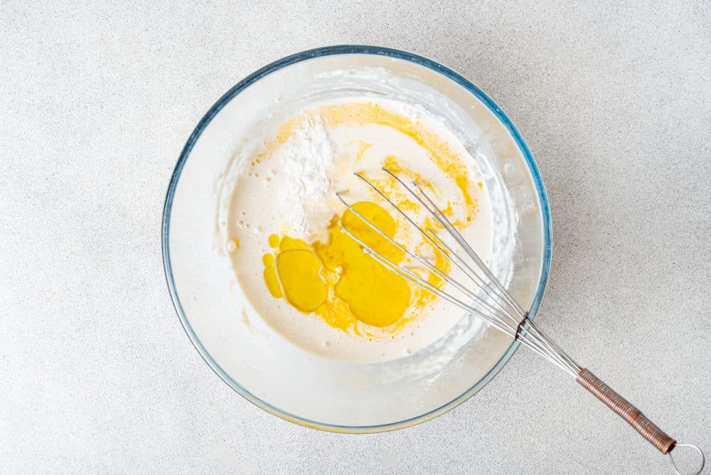 crepe-batter-in-a-clear-bowl-with-a-whisk