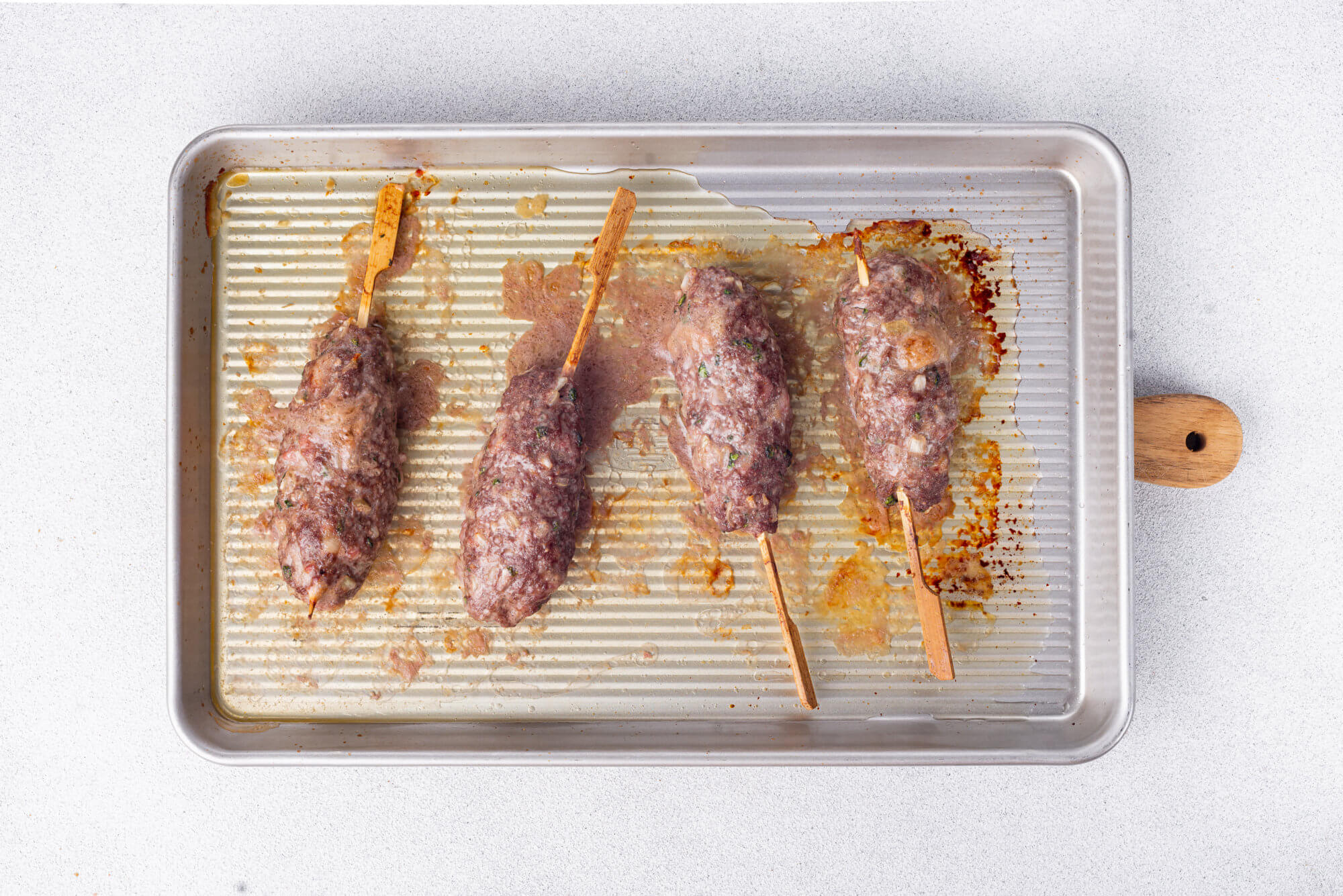 lula-lamb-kebabs-on-a-stick-on-a-baking-tray
