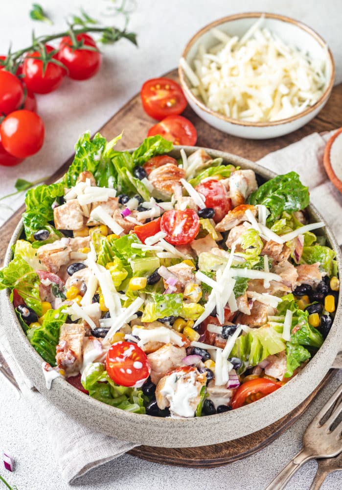 mexican salad with bbq sauce and ranch dressing with shredded cheese and shredded cheese.