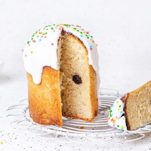 easter-bread-(paska)-with-white-icing-and-sprinkles-on-wire-rack