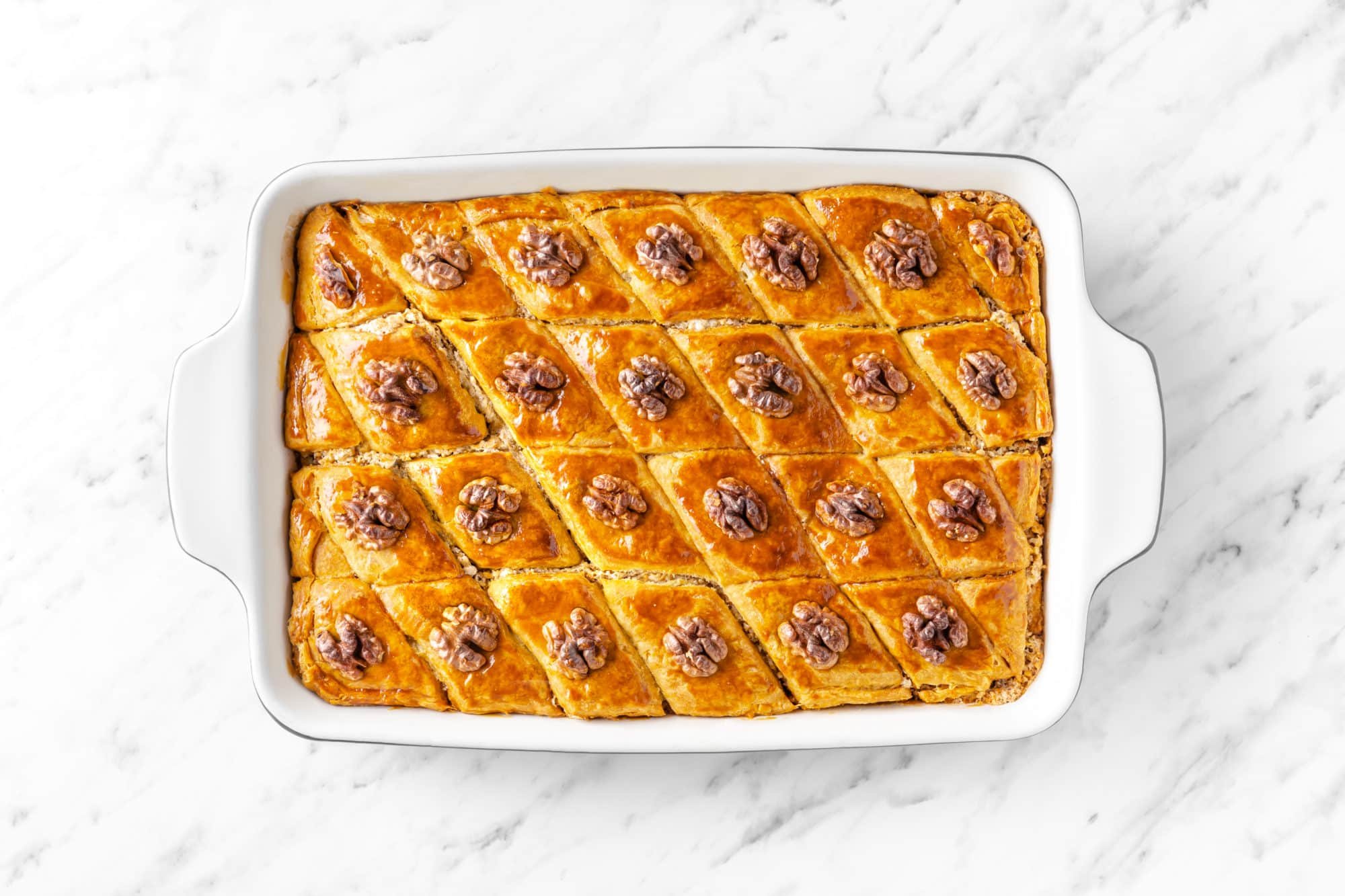 baklava-in-a-baking-tray-with-walnut-pieces-on-top