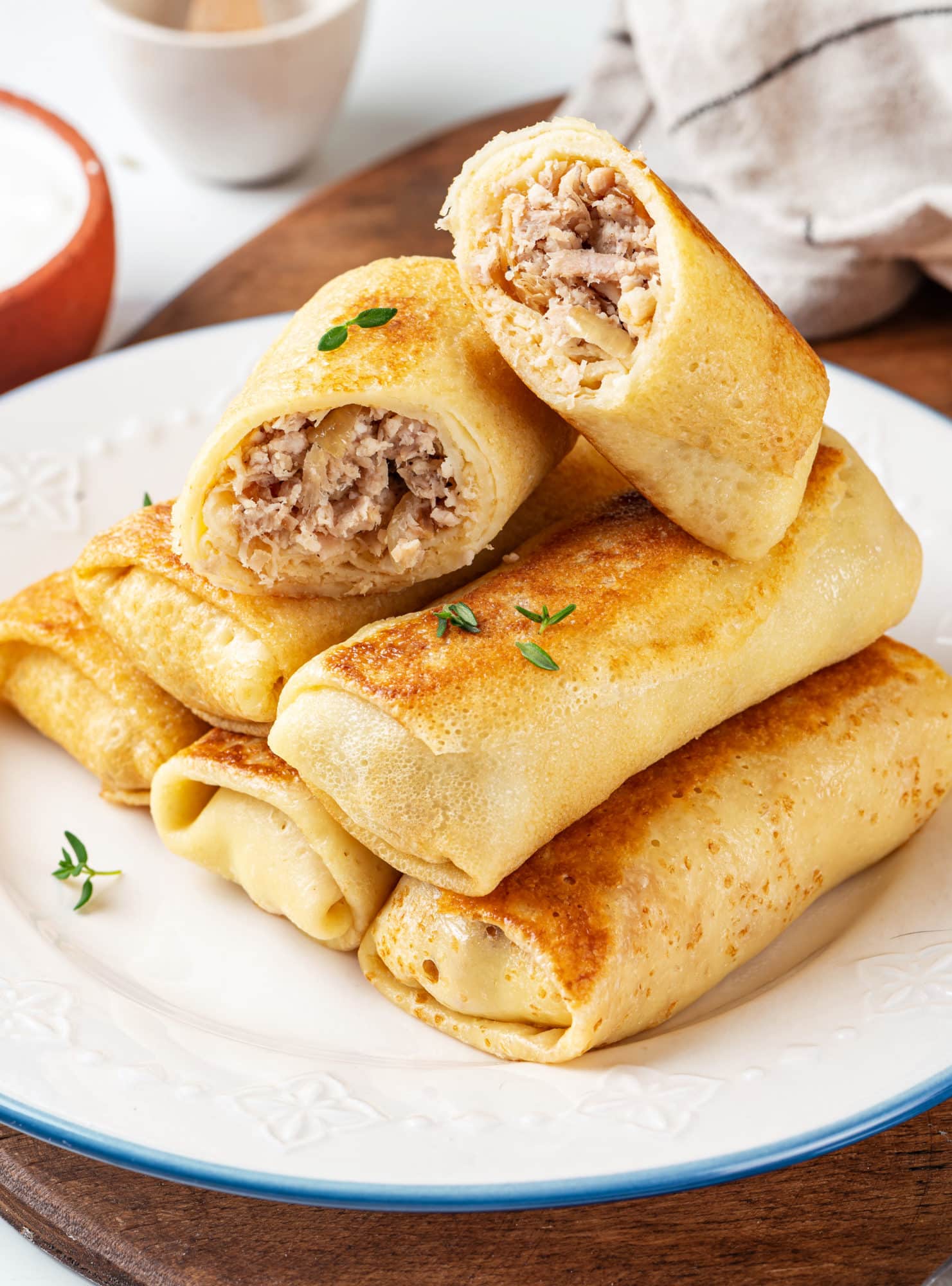 crepes-with-chicken-filling-stacked-on-a-plate