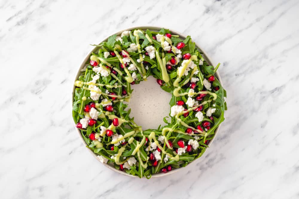 wreath-salad-on-a-plate-with-dressing-drizzled-on-top