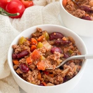 beef-chili-in-a-white-bowl-with-a-spoon