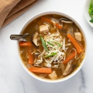 miso-mushroom-soup-in-a-white-bowl-with-a-brown-towel-on-the-side