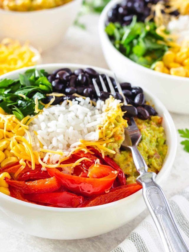 veggie-rice-bowl-recipe-in-a-white-bowl-with-a-fork