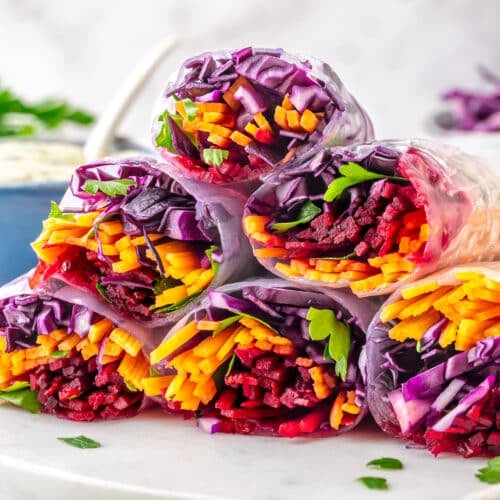 raw veggies rice paper summer rolls filled with cabbage, beets, carrots, parsley.