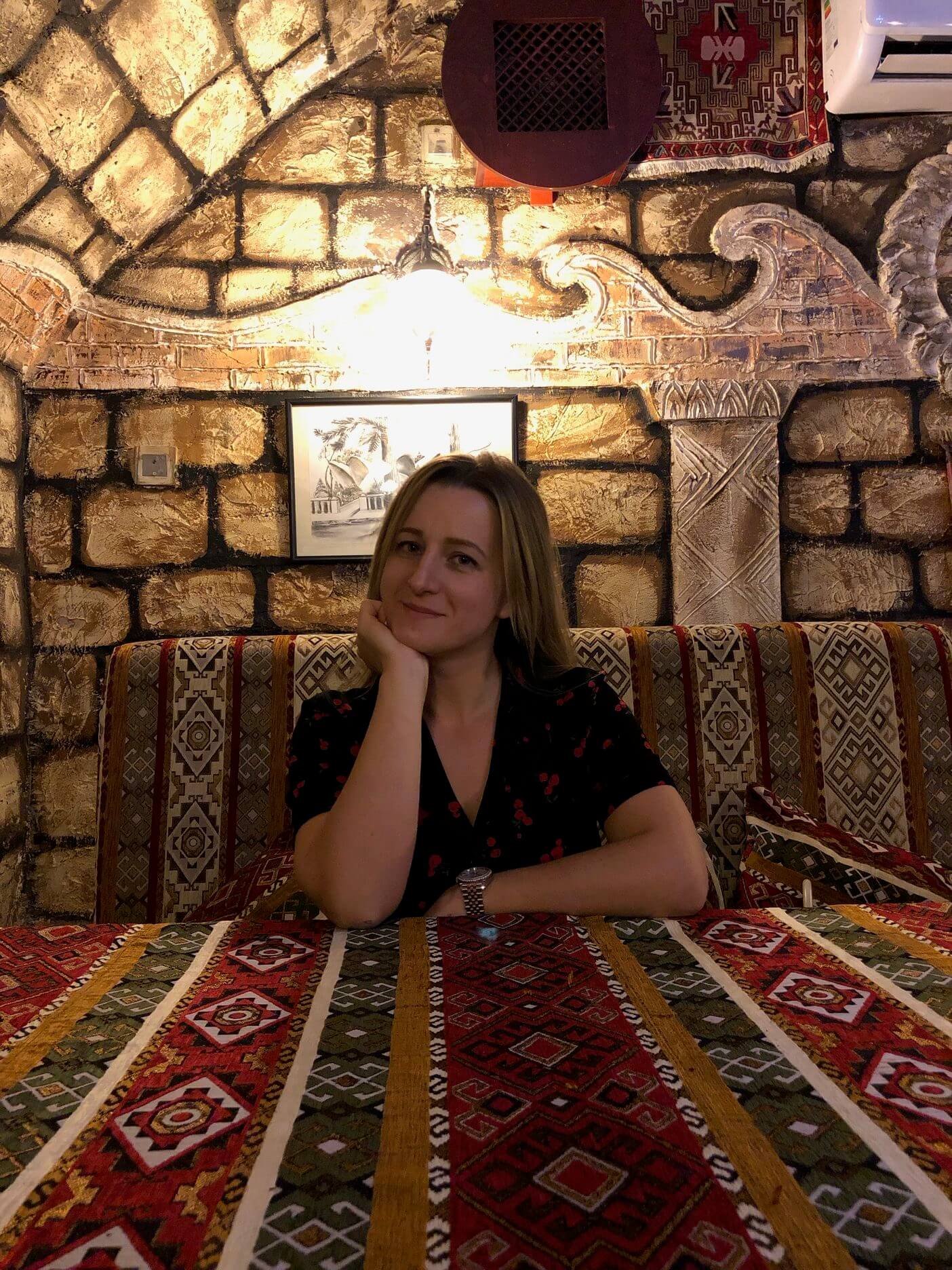 marina-sitting-in-a-restaurant-in-azerbaijan