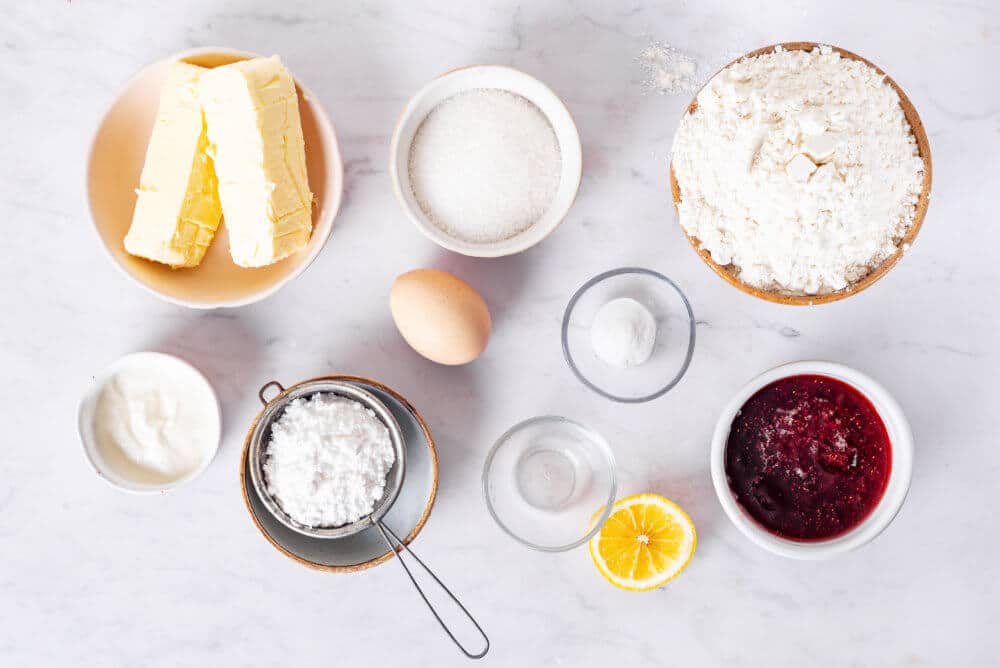 jam-bars-ingredients-sugar-butter-egg-flour-baking-soda-lemon-sour-cream-fruit-jam-and-powdered-sugar