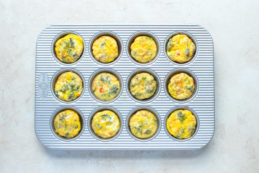 Baked frittata egg muffins in a muffin tin.