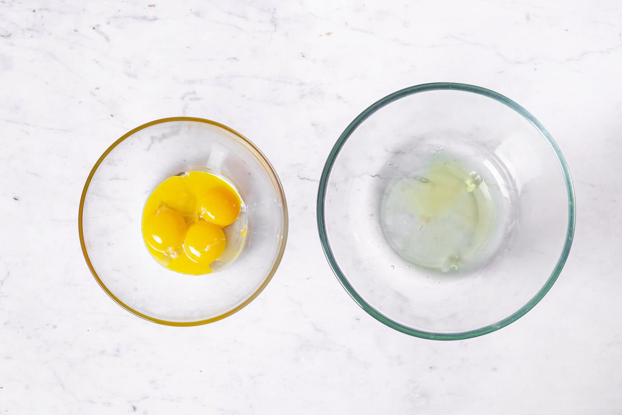 egg-yolks-in-a-glass-bowl-and-egg-whites-in-a-separate-glass-bowl