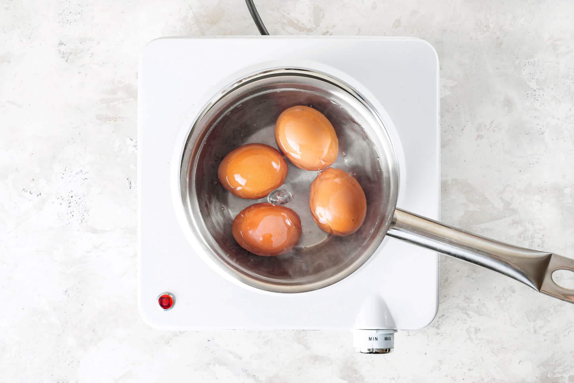 eggs-boiling-in-a-silver-pot-with-water