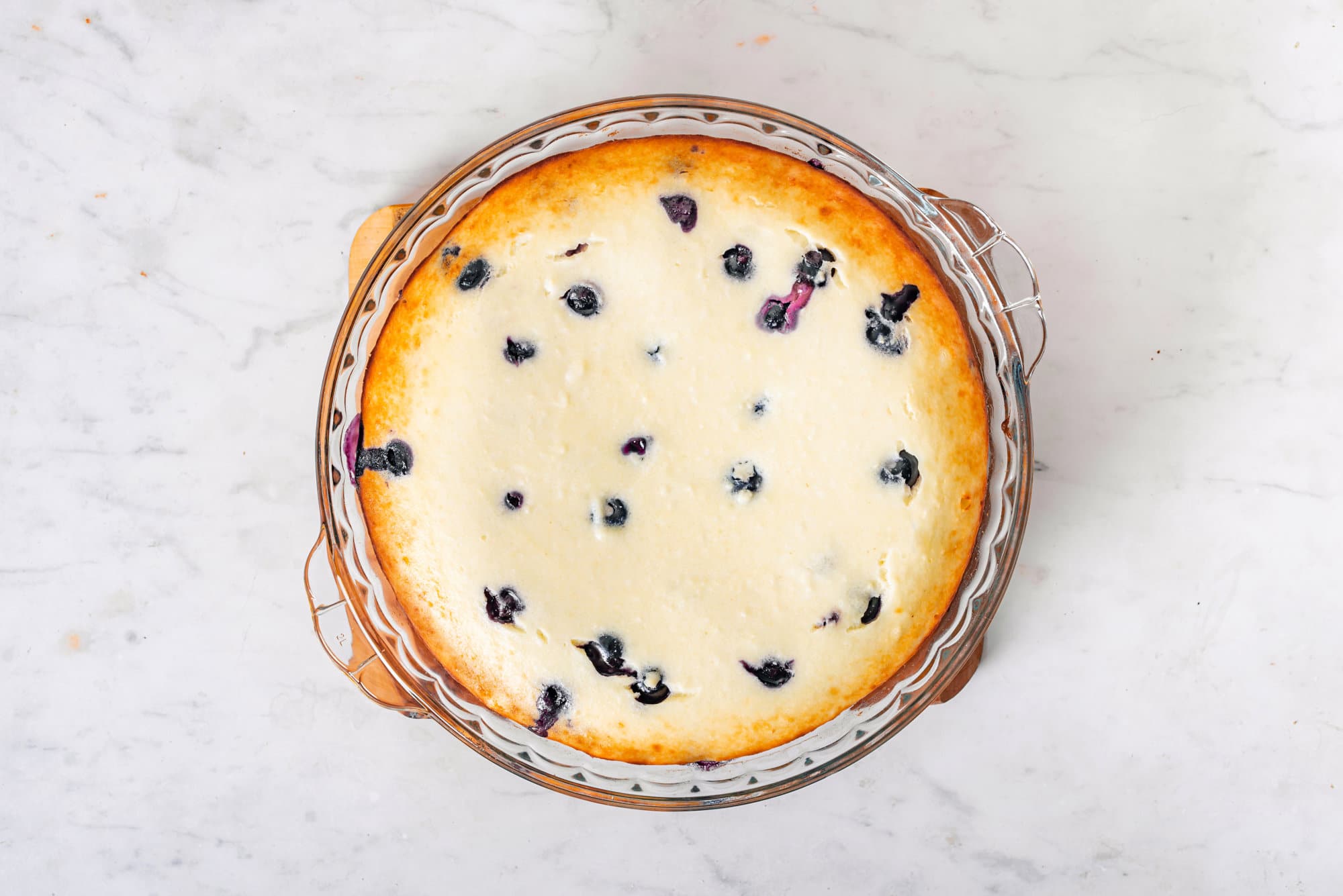 Blueberry cheese cake in a glass tray.