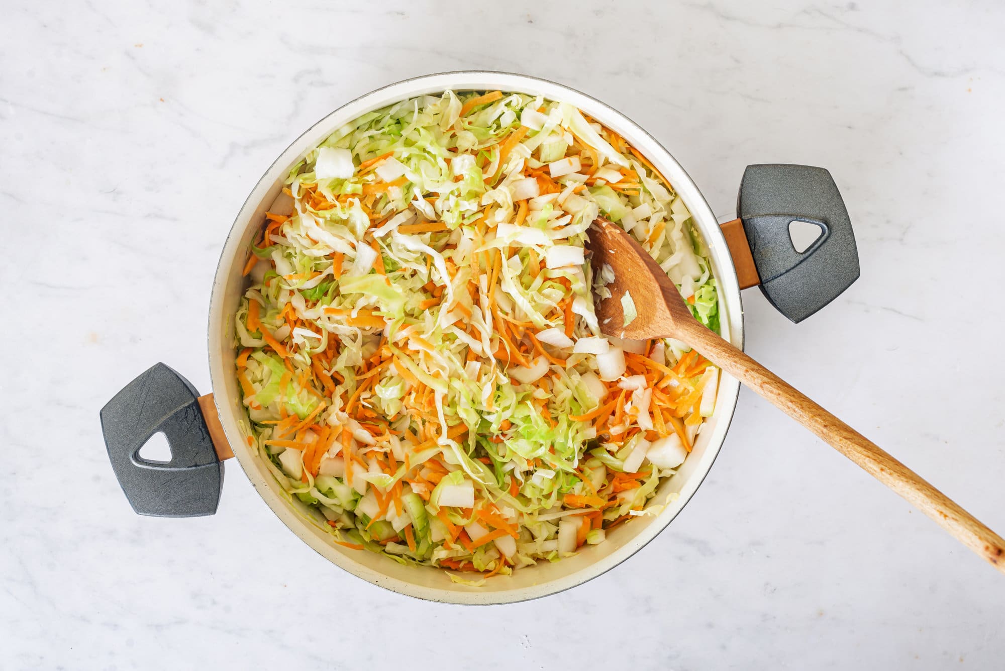 cabbage-in-a-skillet-with-a-wooden-spoon
