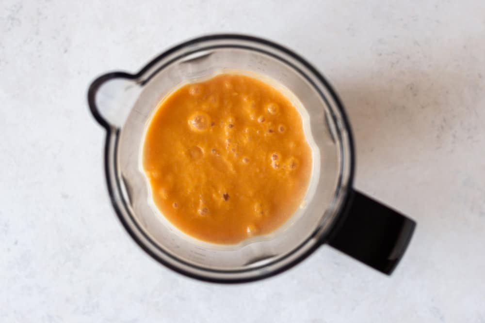 Pumpkin pie smoothie in a blender.