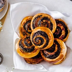 baked pinwheel cookies on a white towel.