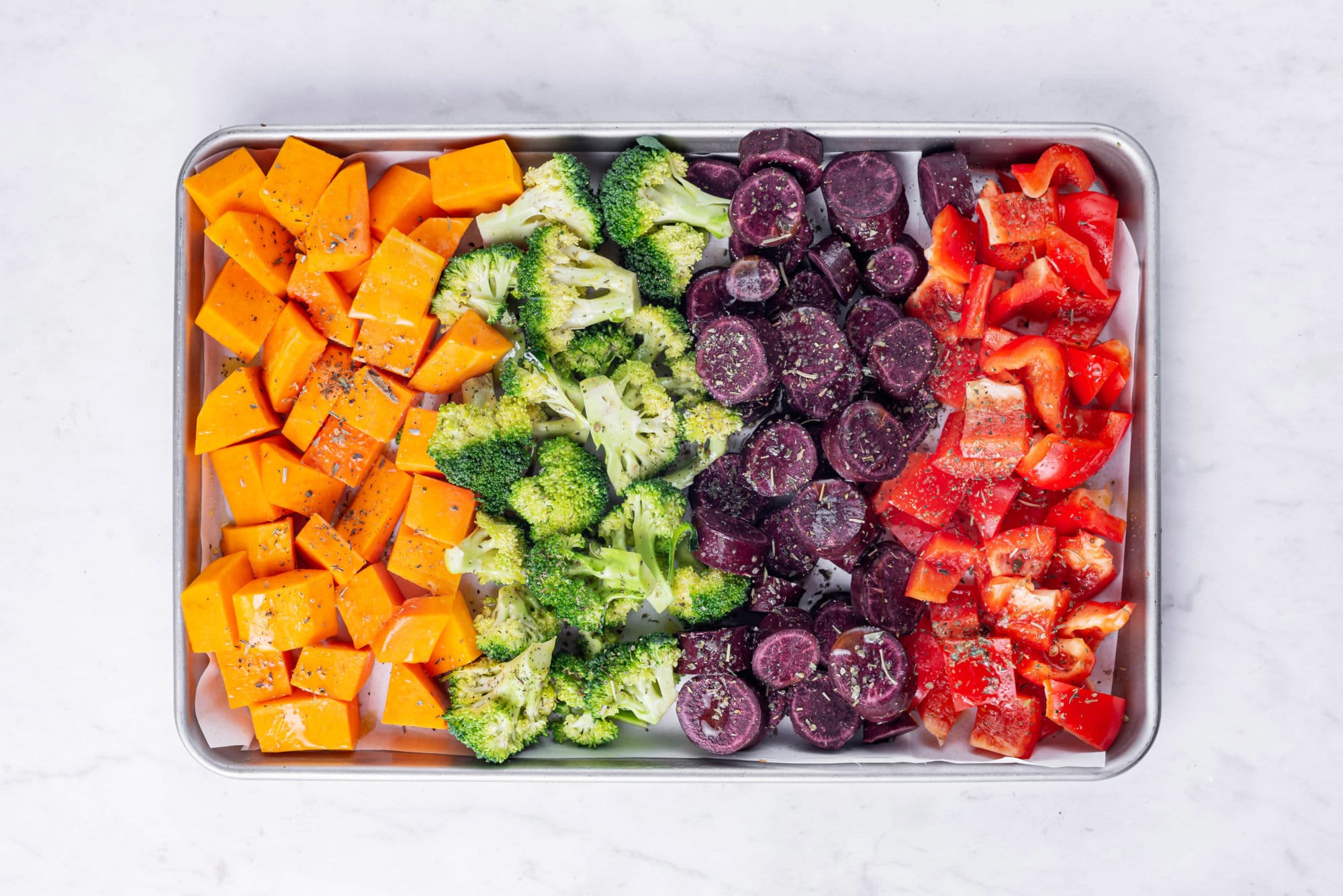 Roasted Vegetables in the Oven with Easy Roasted Garlic Lemon Dressing veggies ready to be baked.