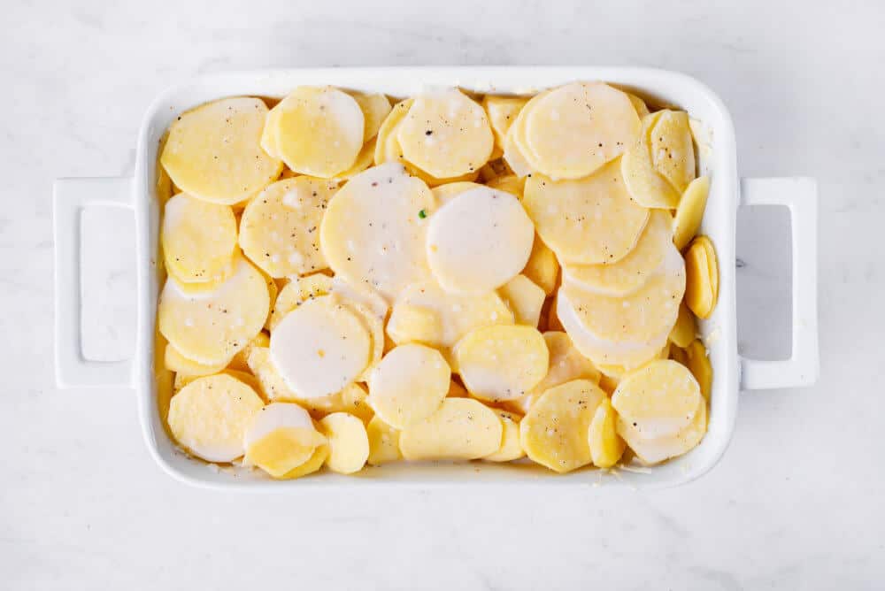 uncooked-scalloped-potatoes-in-baking-dish