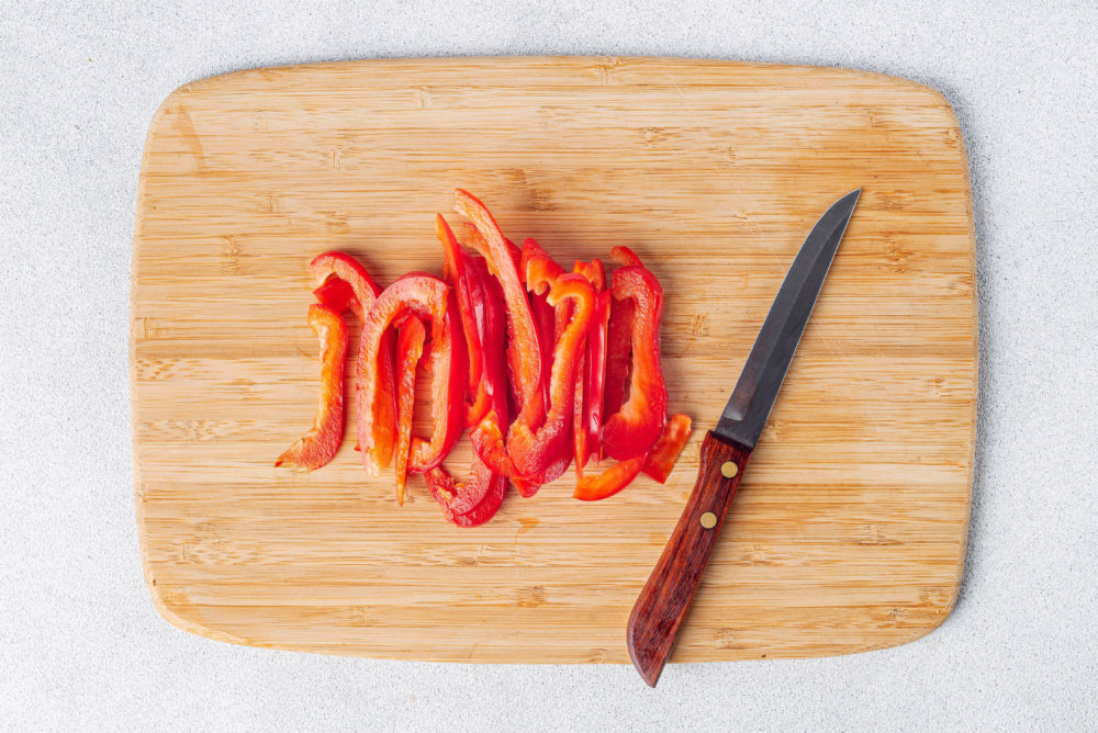 chopped-red-pepper-on-wooden-board-with-knife