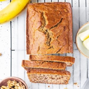 Banana bread sliced on a wire rack.