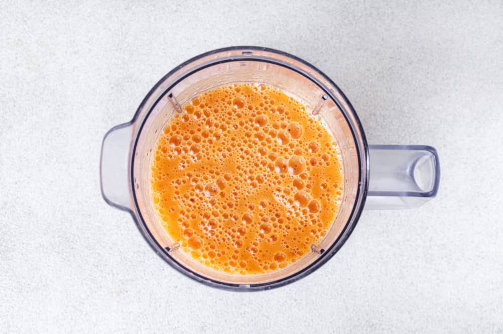 blended apricot smoothie in a blender.