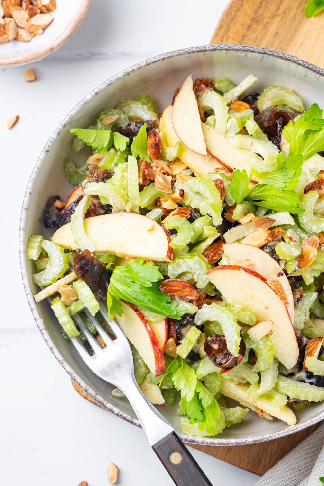 salad of celery and dates in a grey bowl.