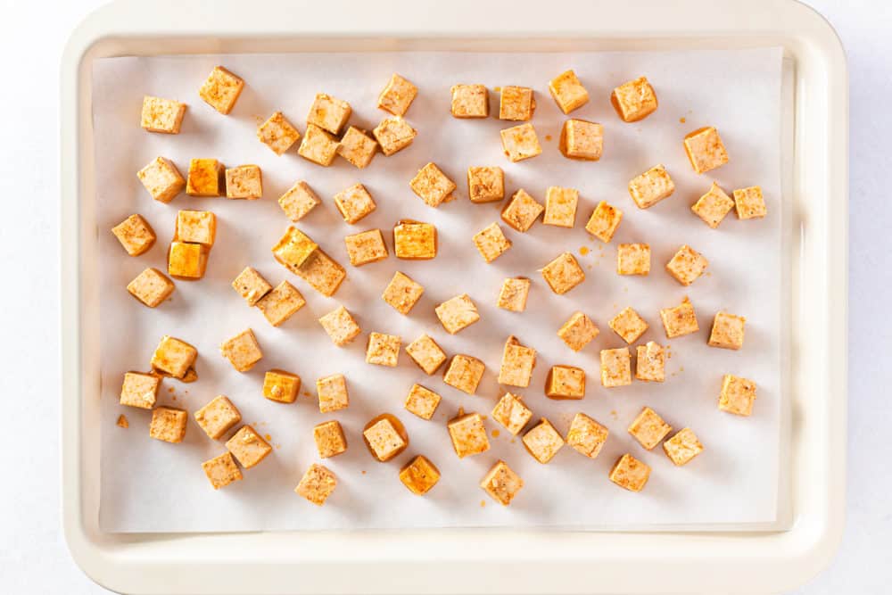 tofu squares on a baking tray.