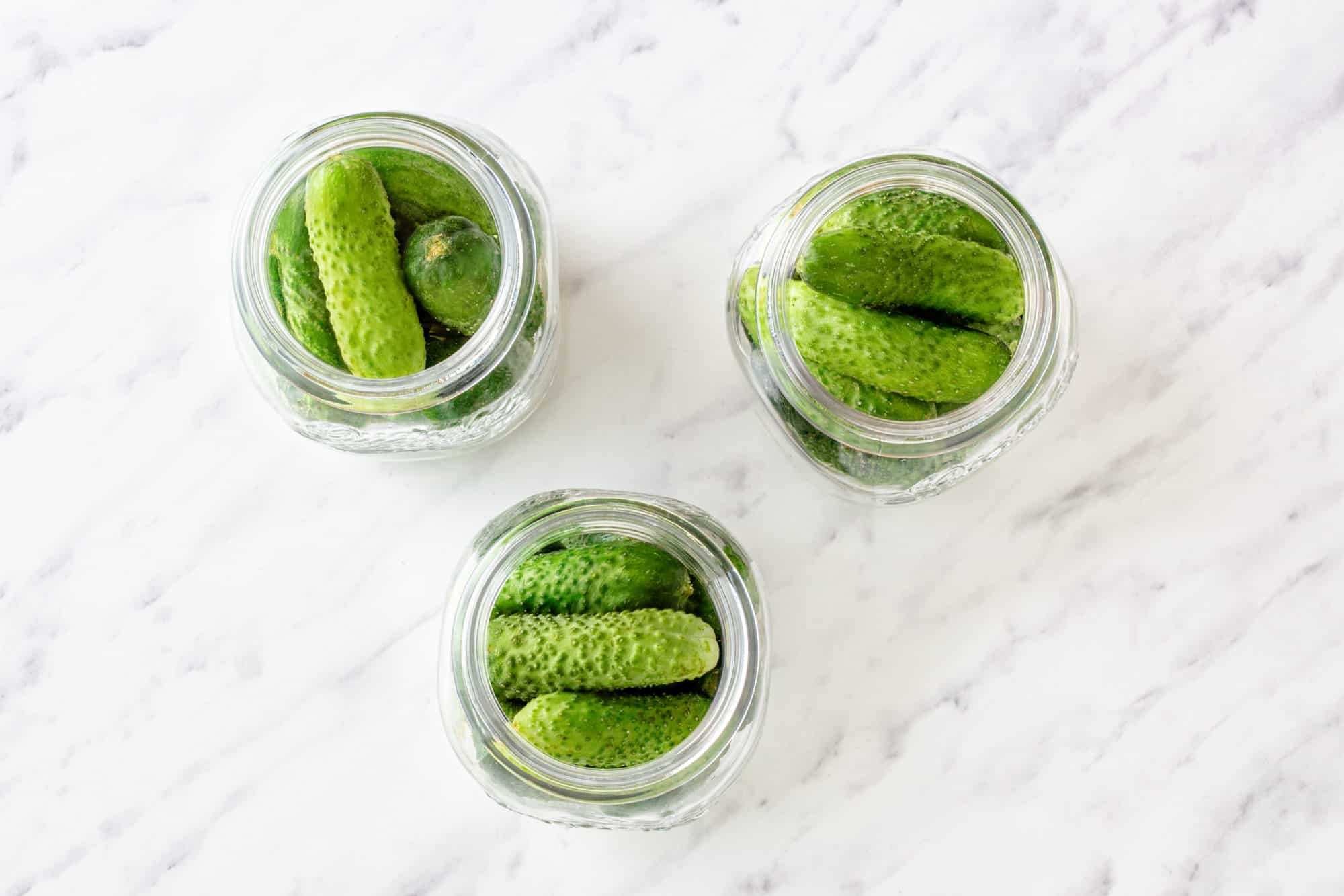 cucumbers in glass jars.