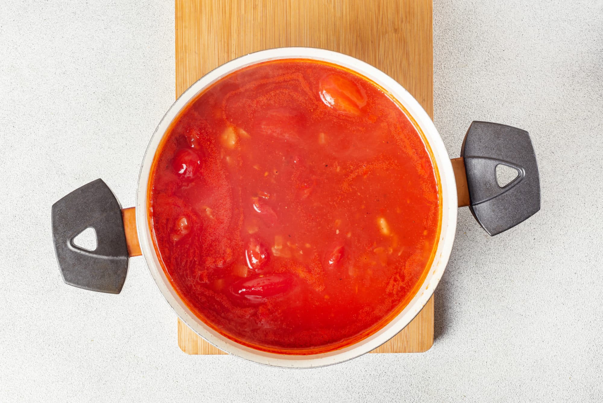 tomato soup cooking in a pot.