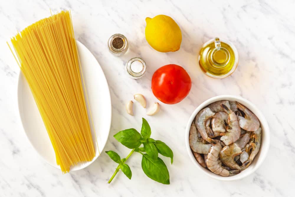 shrimp pasta ingredients angel hair pasta olive oil lemon shrimp tomato garlic basil salt and black pepper.