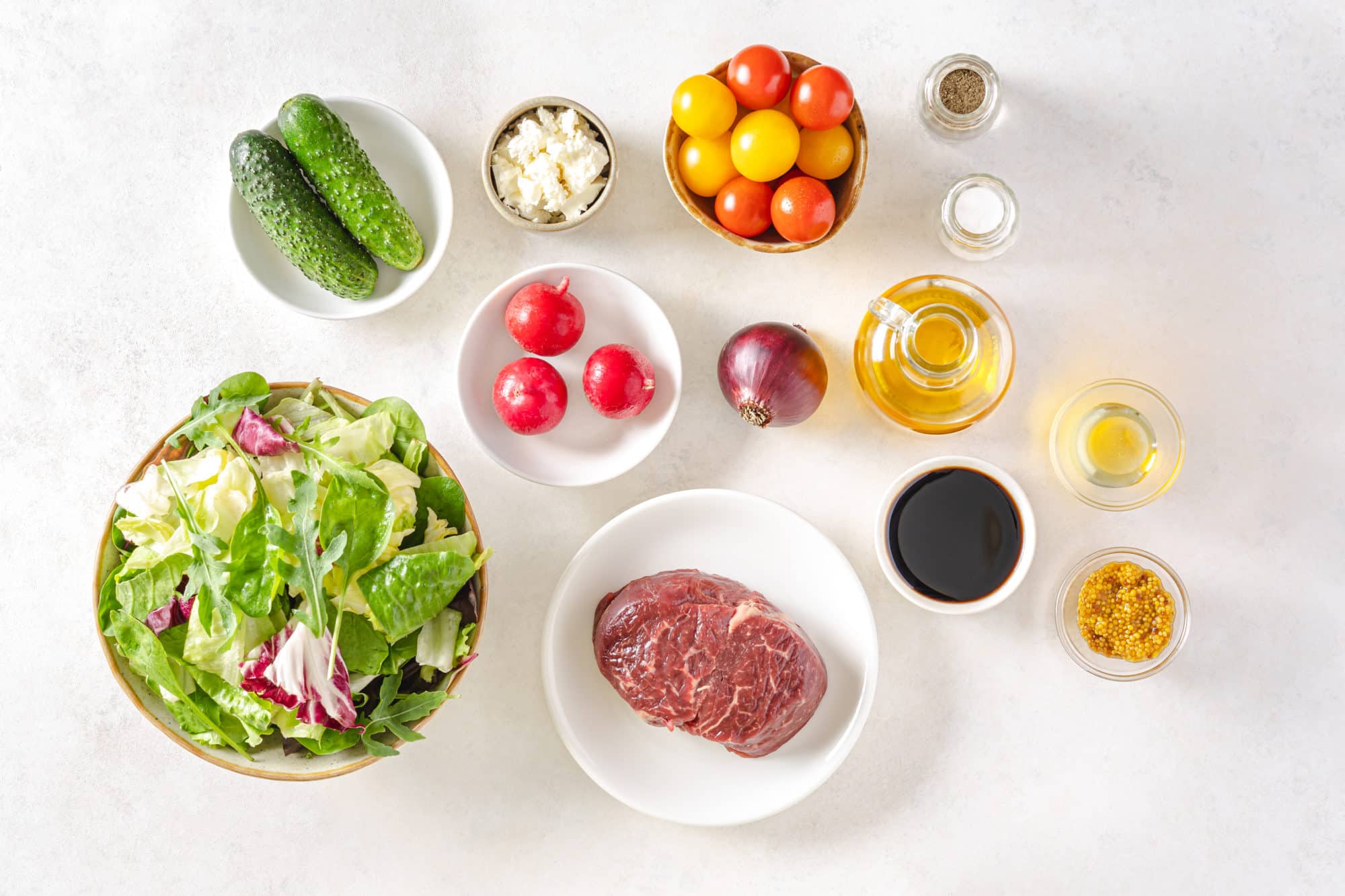 filet-mignon-salad-ingredients-balsamic-vinegar-olive-oil-dijon-mustard-honey-salt-black-pepper-leafy-greens-cherry-tomatoes-cucumbers-red-onion-radishes-feta-cheese-filet-mignon-and-olive-oil
