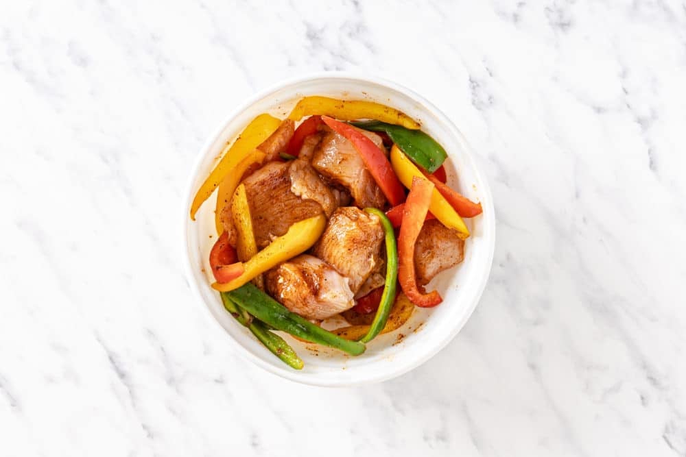 marinated-chicken-and-bell-peppers-in-a-white-bowl