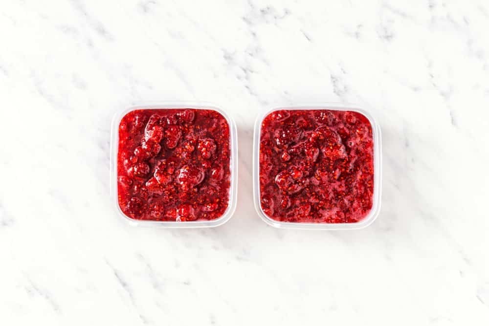 two-square-containers-of-jam-side-by-side