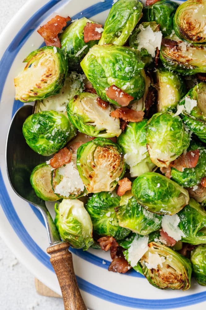 brussels-sprouts-in-a-blue-and-white-bowl-with-a-spoon