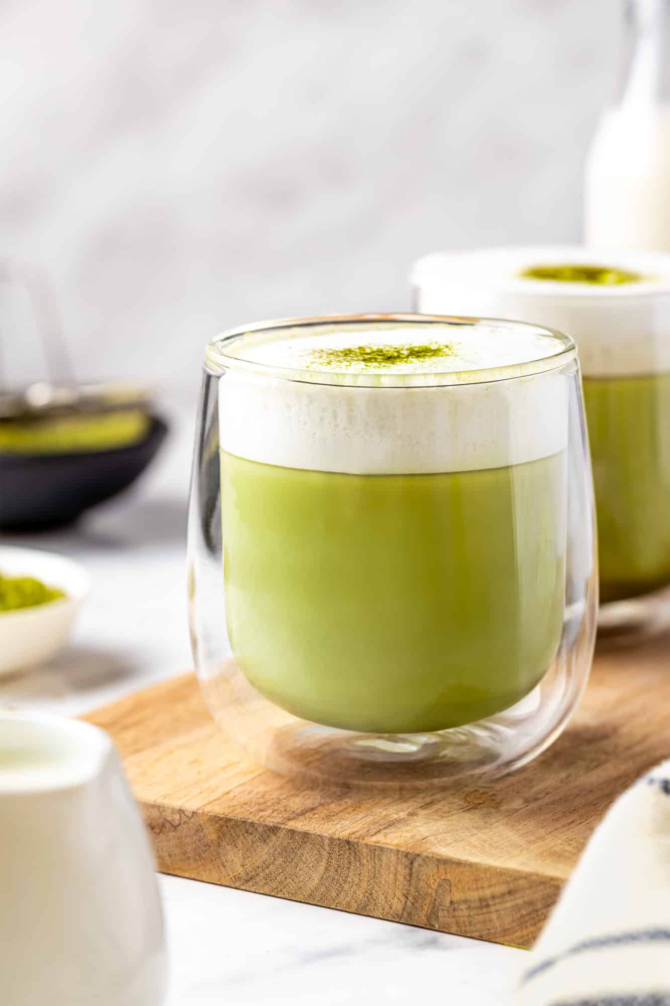 matcha latte with frothed milk on top.