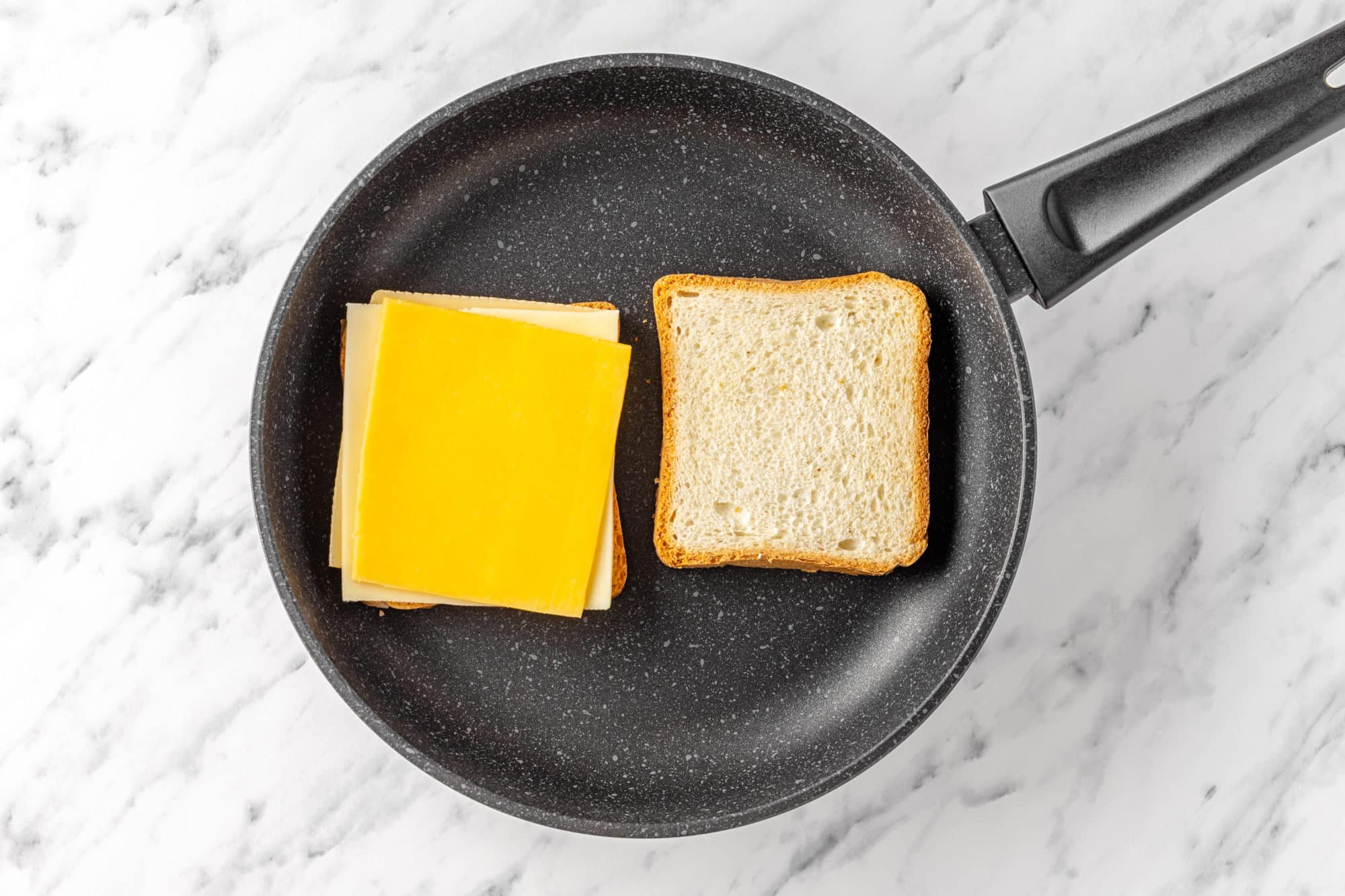 cheese on bread in a skillet.