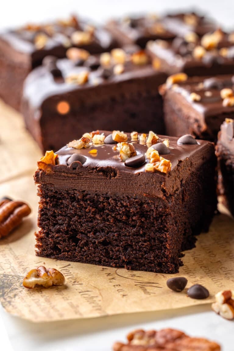 gluten free chocolate brownie square with nuts and chocolate chips.